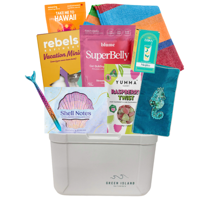 Summer gift cooler featuring a colourful Turkish towel, shell stationery set, Mojito candle, vacation-inspired treats, Raspberry Twist gummies, tropical accessories, hydration mix, and beach essentials by Black Bow Gift Co.
