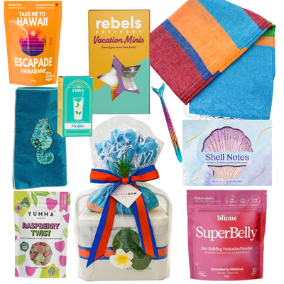 Summer gift cooler featuring a colourful Turkish towel, shell stationery set, Mojito candle, vacation-inspired treats, Raspberry Twist gummies, tropical accessories, hydration mix, and beach essentials by Black Bow Gift Co.