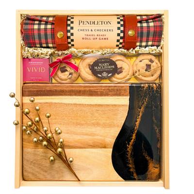 Luxury entertainer’s gift box with chess, charcuterie, and coffee table book