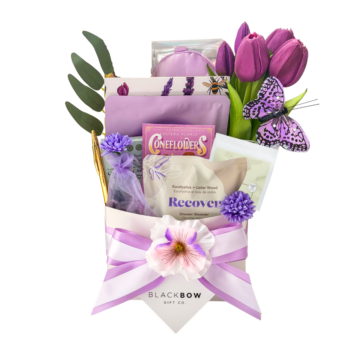 Comfort in Bloom self care gift basket with tulips, wellness items and treats by Black Bow Gift Co.