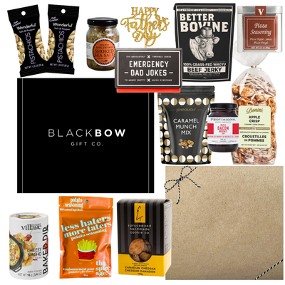 Dad’s Snack Stash Father’s Day gourmet gift box with jerky, pistachios, caramel snacks, smoky seasonings, cookies, dip mix, and dad-themed treats in a sleek black gift box.