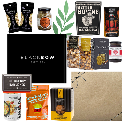 Dad’s Snack Stash Father’s Day gourmet gift box with jerky, pistachios, caramel snacks, smoky seasonings, chocolates, dip mix, and dad-themed treats in a sleek black gift box.