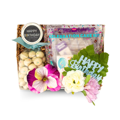 A Birthday Treat gift box with celebration cake kit, birthday cake cookies, sprinkles and Happy Birthday candle