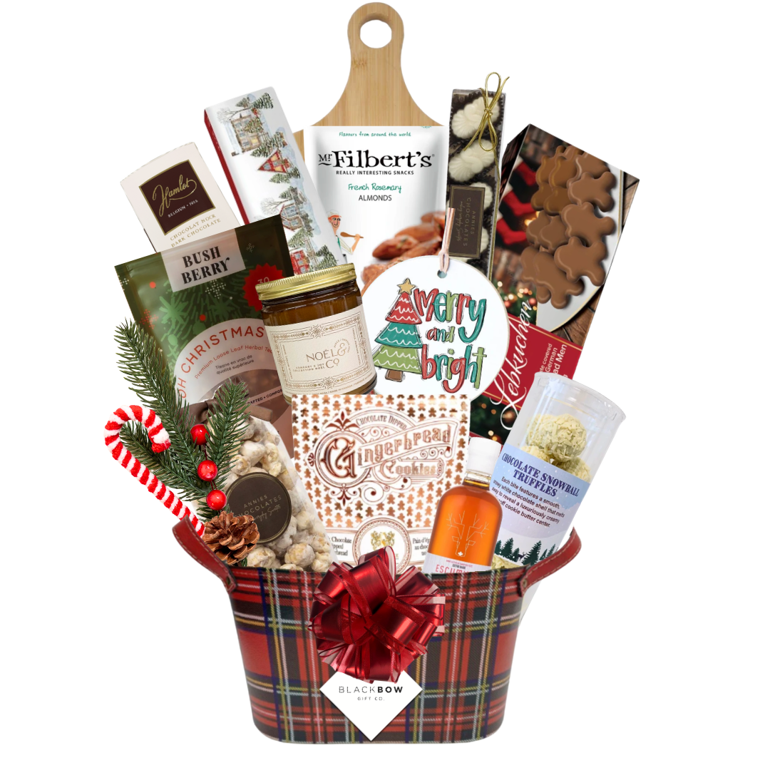 A Taste of Christmas gourmet holiday gift basket in a red tartan leatherette keepsake basket with chocolates, savoury snacks, gingerbread treats, festive greenery and optional candle.