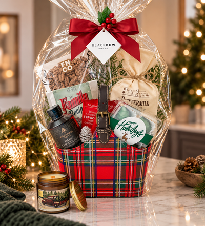 A Merry Morning Christmas breakfast gift in a red tartan leatherette keepsake basket with pancake mix, maple treats, hot chocolate, chocolates and optional candle.