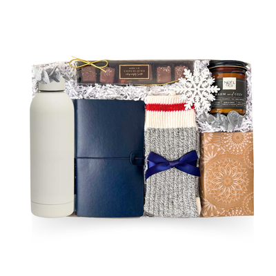 A Moment for You gift box with cozy socks, candle, water bottle, notebook and chocolate treats.