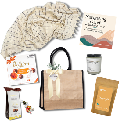 Wrapped in Comfort sympathy gift with soft throw blanket, guided grief journal, chamomile tea, candle and chocolates.