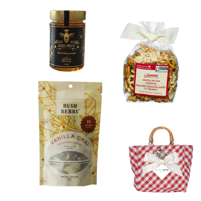 A Sweet Gesture gift featuring vanilla chai tea, gourmet honey and maple pecan crunch in a red gingham tote with ivory bow and Black Bow Gift Co. gift tag.