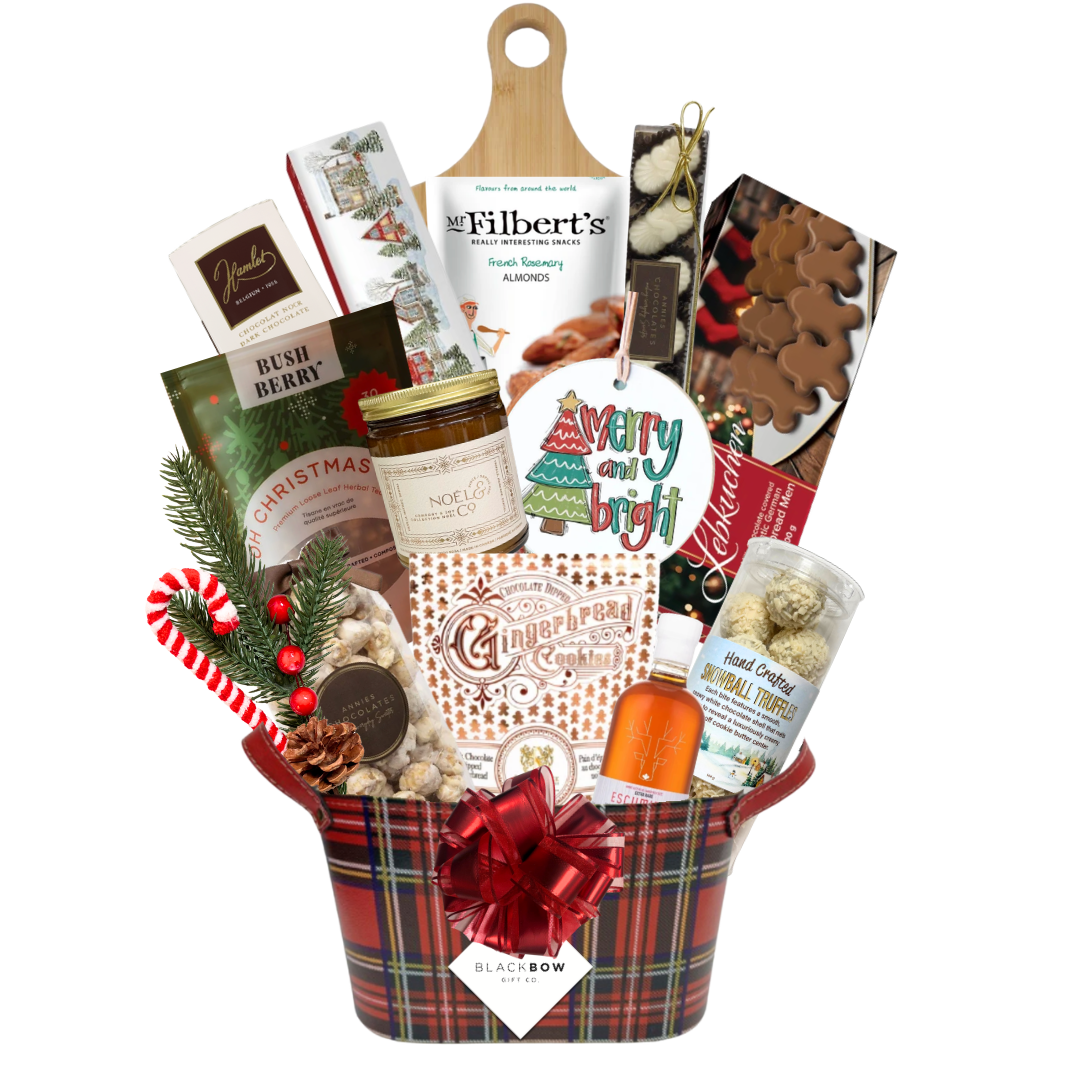 A Taste of Christmas gourmet holiday gift basket in a red tartan leatherette keepsake basket with chocolates, savoury snacks, gingerbread treats, festive greenery and optional candle.