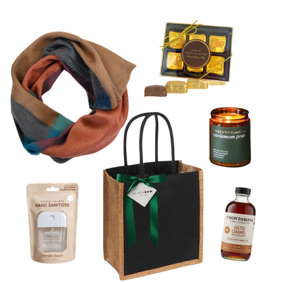A Warm Gesture gift with colourful scarf, candle, chocolates, salted caramel syrup and reusable tote.