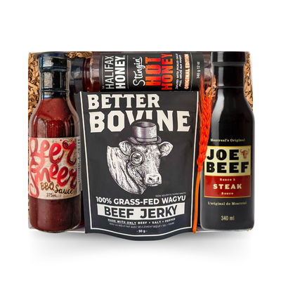 BBQ gift box featuring gourmet barbecue sauces, bacon jam, beef jerky, hot honey, and grilling favourites presented in a signature gift box by Black Bow Gift Co.