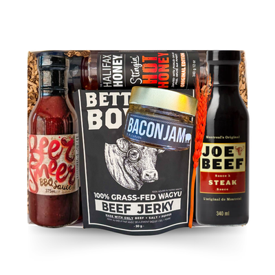 BBQ gift box featuring gourmet barbecue sauces, bacon jam, beef jerky, hot honey, and grilling favourites presented in a signature gift box by Black Bow Gift Co.