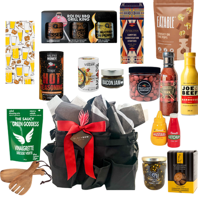 BBQ gift bag featuring gourmet grilling sauces, seasonings, snacks, serving accessories, and reusable organizer bag by Black Bow Gift Co.
