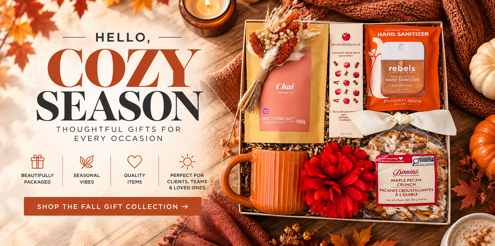 Cozy fall gift box with chai tea, cinnamon apple room spray, pumpkin spice hand sanitizer, ceramic mug, maple pecan crunch and seasonal florals styled with warm autumn accents. Direction to shop the Fall Gift Collection 