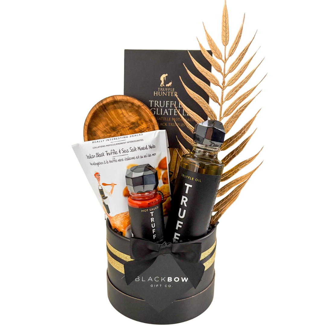 Luxury Black Truffle Indulgence gift basket in black and gold with upscale presentation for gourmet gifting.