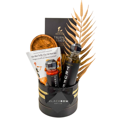 Luxury Black Truffle Indulgence gift basket in black and gold with upscale presentation for gourmet gifting.