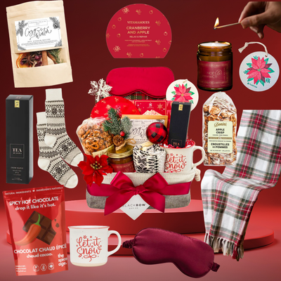 Luxury Brr Basket winter gift with blanket, candle, tea, socks, and seasonal treats creating a cozy holiday experience.