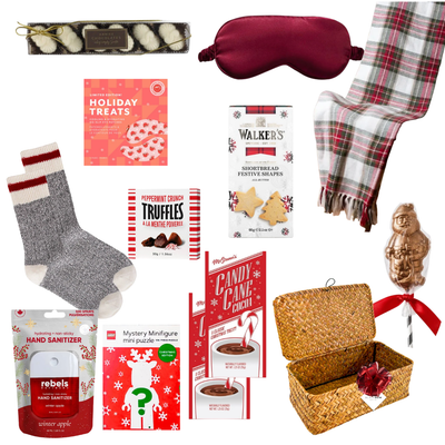 Brr Basket Christmas gift basket with cozy winter socks, LEGO holiday puzzle, festive chocolates, shortbread and seasonal treats in a woven basket.