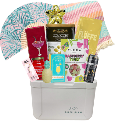 Summer gift cooler featuring a colourful Turkish towel, tropical fan, Piña Colada candle, mocktail-inspired treats, Raspberry Twist gummies, tropical accessories, and beach-inspired essentials by Black Bow Gift Co.