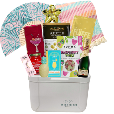Summer gift cooler featuring a colourful Turkish towel, tropical fan, Piña Colada candle, mocktail-inspired treats, Raspberry Twist gummies, tropical accessories, and beach-inspired essentials by Black Bow Gift Co.