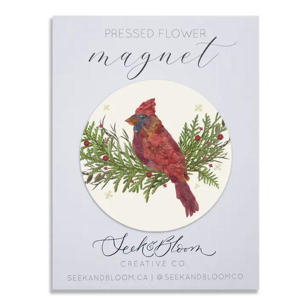 Pressed flower cardinal artwork magnet featuring a winter-inspired nature design with delicate floral details.