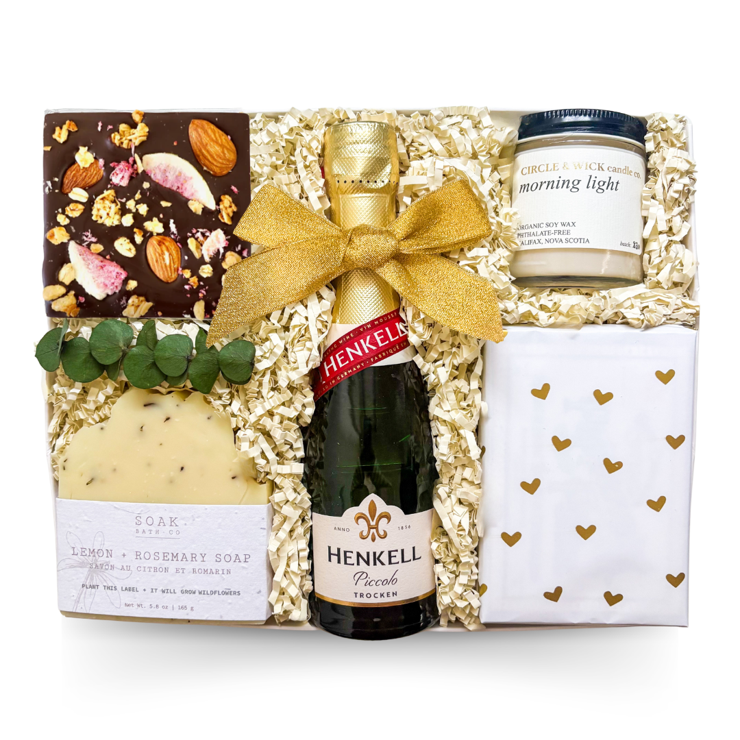 Cloud Nine celebration gift box with Henkell sparkling wine, artisan chocolate bark, soy candle, handcrafted lemon rosemary soap, and premium gift packaging.