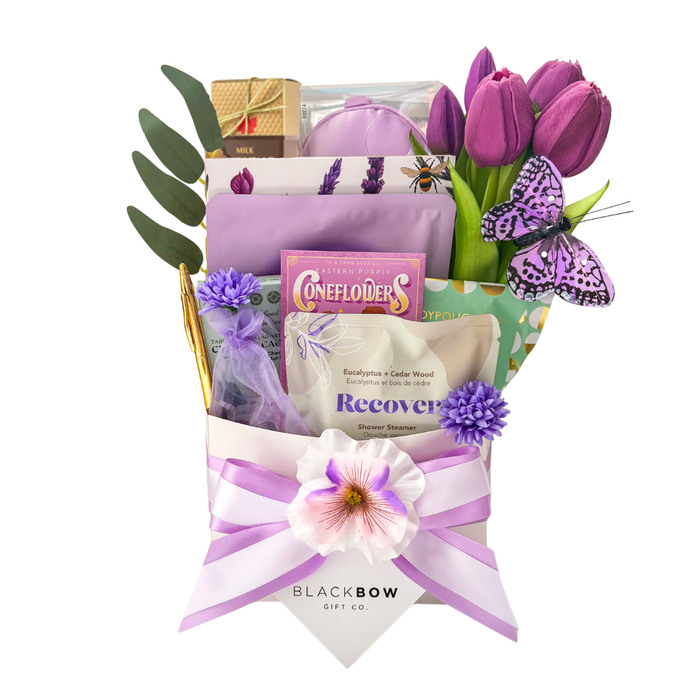 Comfort in Bloom self care gift basket with tulips, wellness items and treats by Black Bow Gift Co.