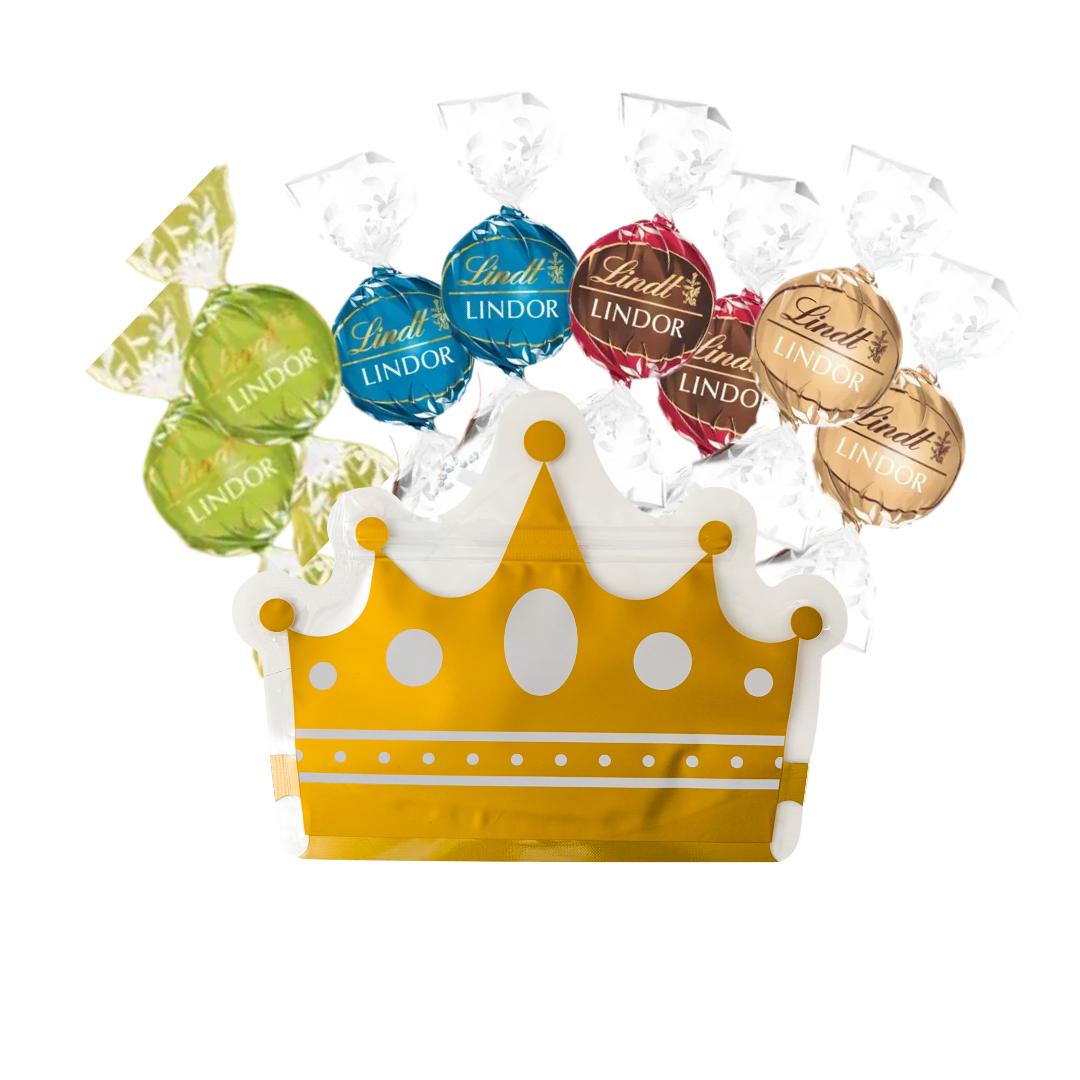 Lindt chocolate truffles in a decorative gold crown-shaped pouch, featuring Double Chocolate, Fudge Swirl, Caramel Sea Salt, and Pistachio flavours in colourful foil wrappers, perfect for luxury gift boxes and gourmet hampers.