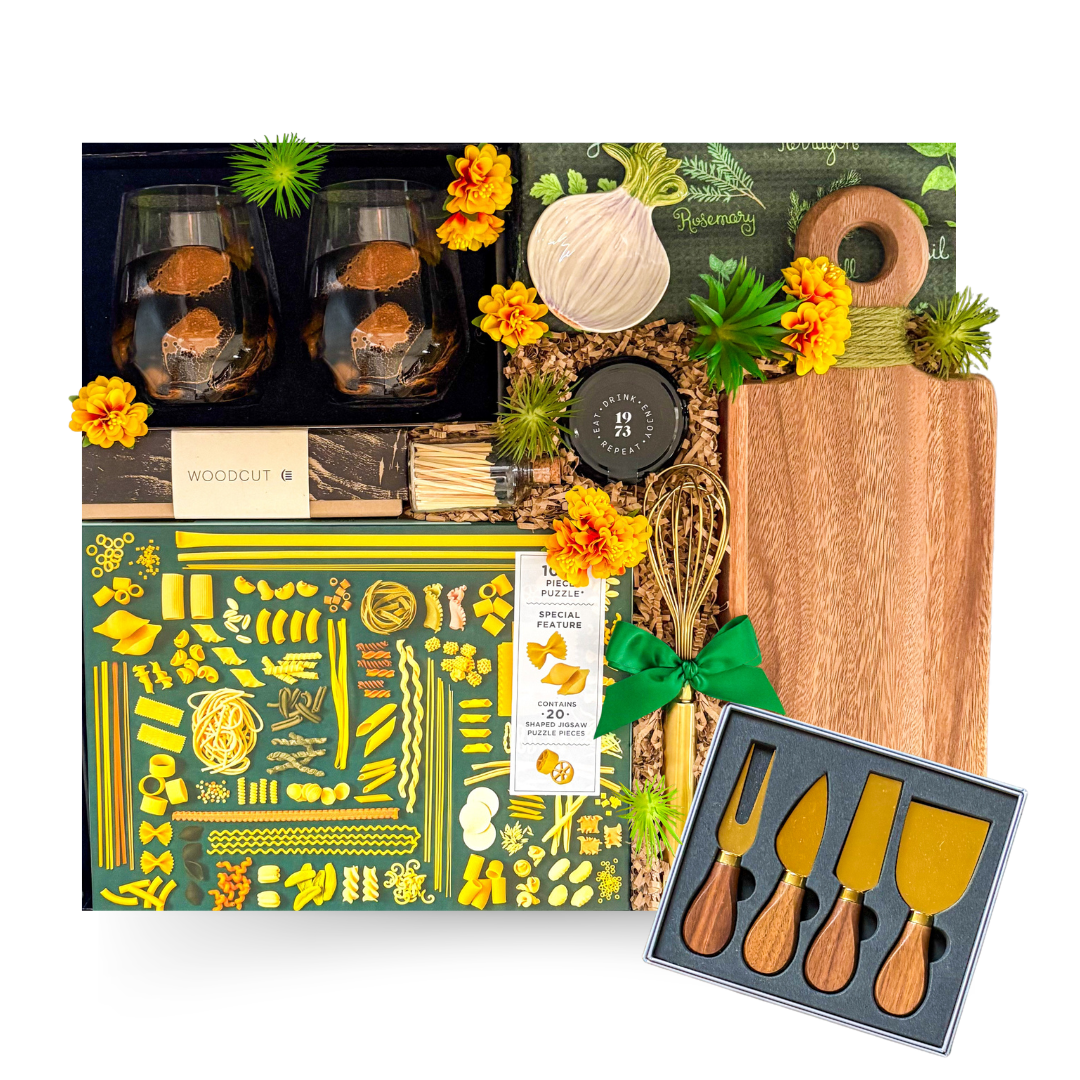 Luxury home gift basket in a large high-gloss black magnetic keepsake gift box featuring artisan coffee, premium olive oil, handcrafted serving board, cheese knife set, gourmet foods, breakfast essentials, and elegant home keepsakes.

