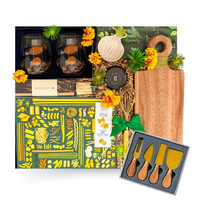 Luxury home gift basket in a large high-gloss black magnetic keepsake gift box featuring artisan coffee, premium olive oil, handcrafted serving board, cheese knife set, gourmet foods, breakfast essentials, and elegant home keepsakes.