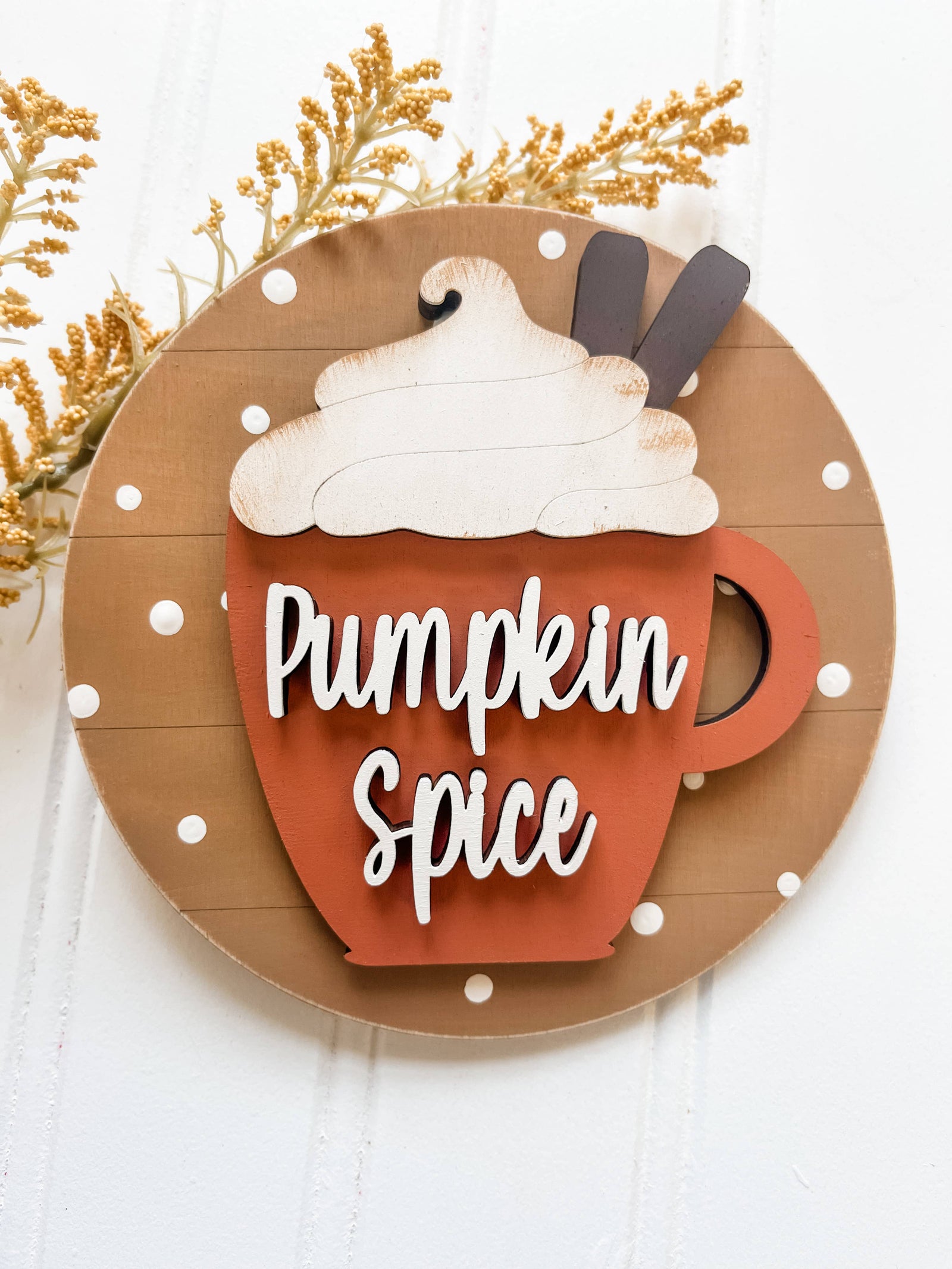 Pumpkin spice DIY Christmas ornament kit featuring a wooden mug with whipped cream and cinnamon sticks