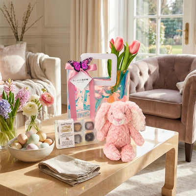 Easter Bunny Treats gift with plush bunny, tulip bouquet and hand painted caramels by Black Bow Gift Co.