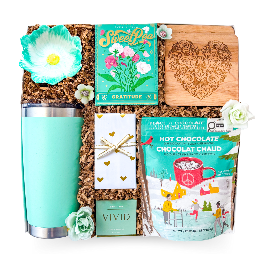 Electric Bloom turquoise gift box with heart accents, premium treats and symbolic seed pack by Black Bow Gift Co.
