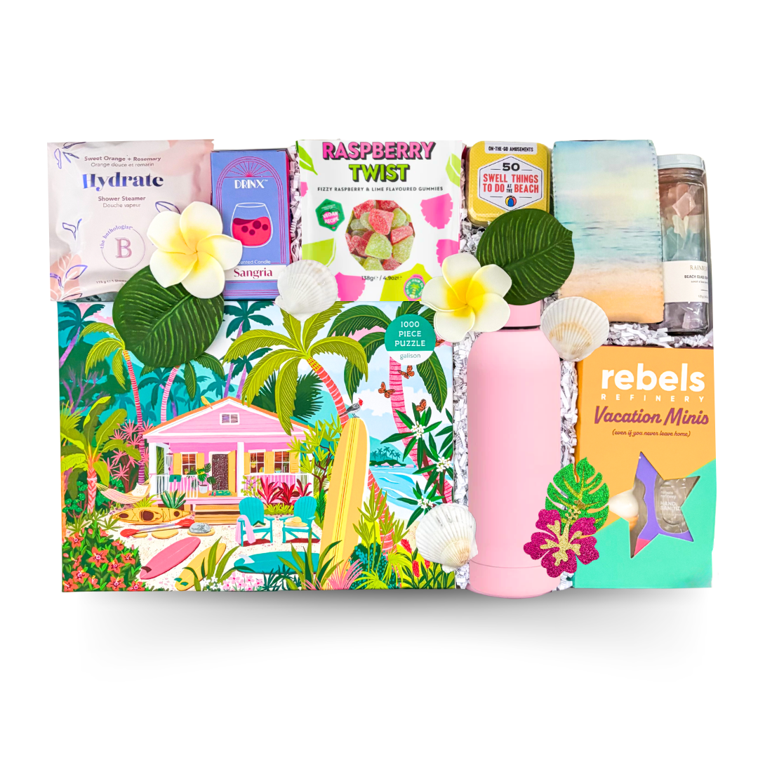 Summer-themed gift box featuring a tropical puzzle, sangria candle, reusable water bottle, vacation-inspired activities, sweet treats, self-care essentials, and beach-inspired accessories by Black Bow Gift Co.