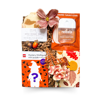 Fall Favourites autumn gift box featuring apple orchard soap, pumpkin spice hand sanitizer, Halloween LEGO mystery mini puzzle and seasonal fall details, with an optional pumpkin bath bomb from Black Bow Gift Co.