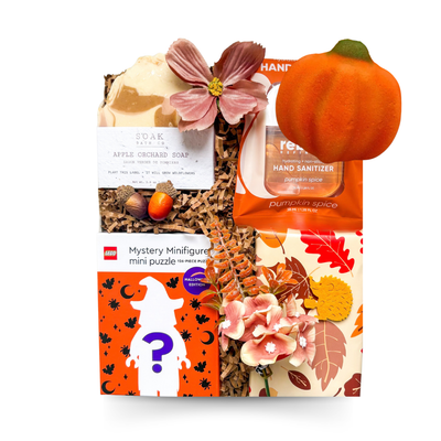 Fall Favourites autumn gift box featuring apple orchard soap, pumpkin spice hand sanitizer, Halloween LEGO mystery mini puzzle and seasonal fall details, with an optional pumpkin bath bomb from Black Bow Gift Co.