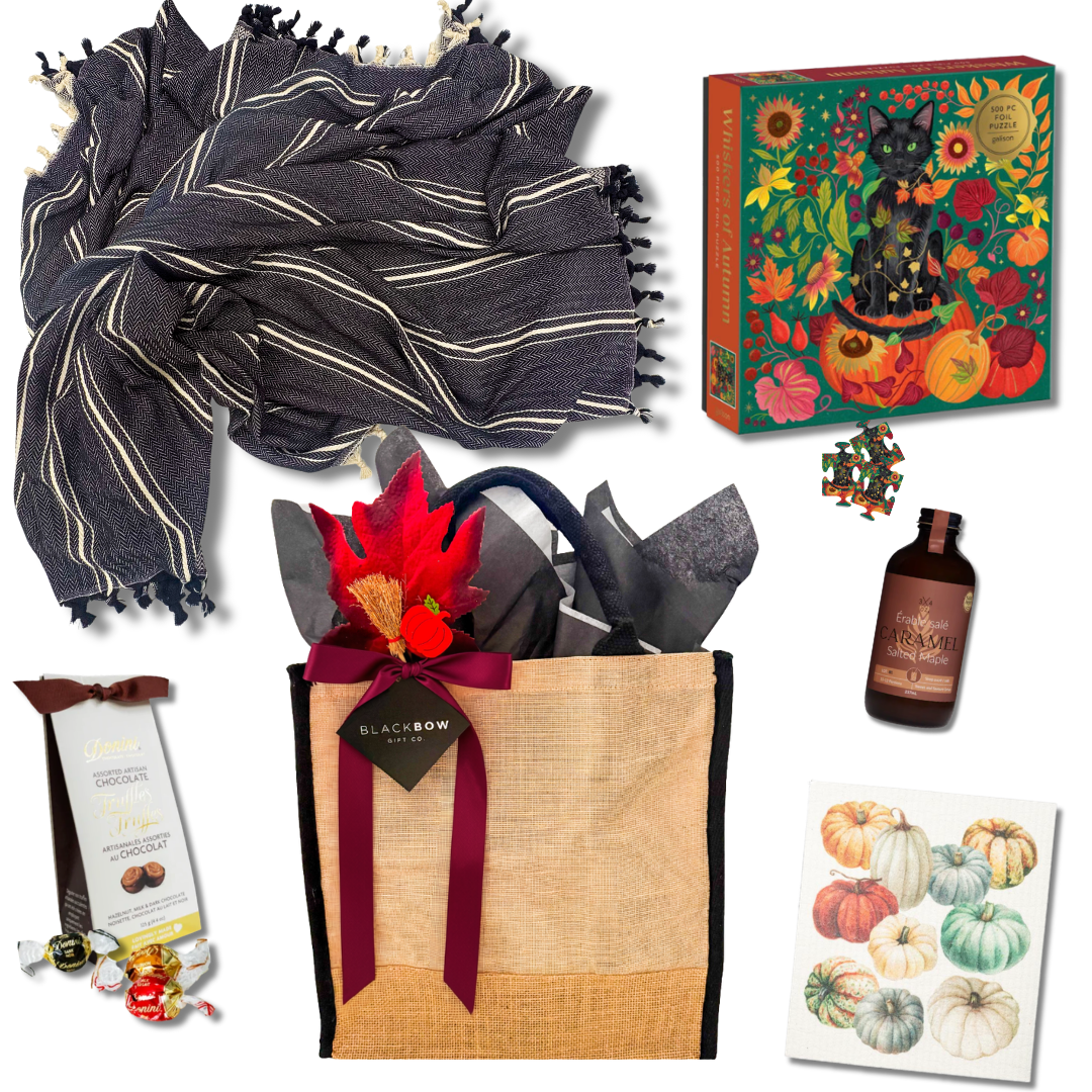 Fall at Home gift basket with cozy throw, fall puzzle, maple drink, chocolates and seasonal kitchen towel
