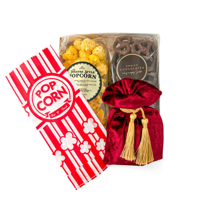 Feature Presentation movie night gift with theatre-style popcorn, chocolate pretzels, velvet treat pouch and optional movie-inspired ornament.