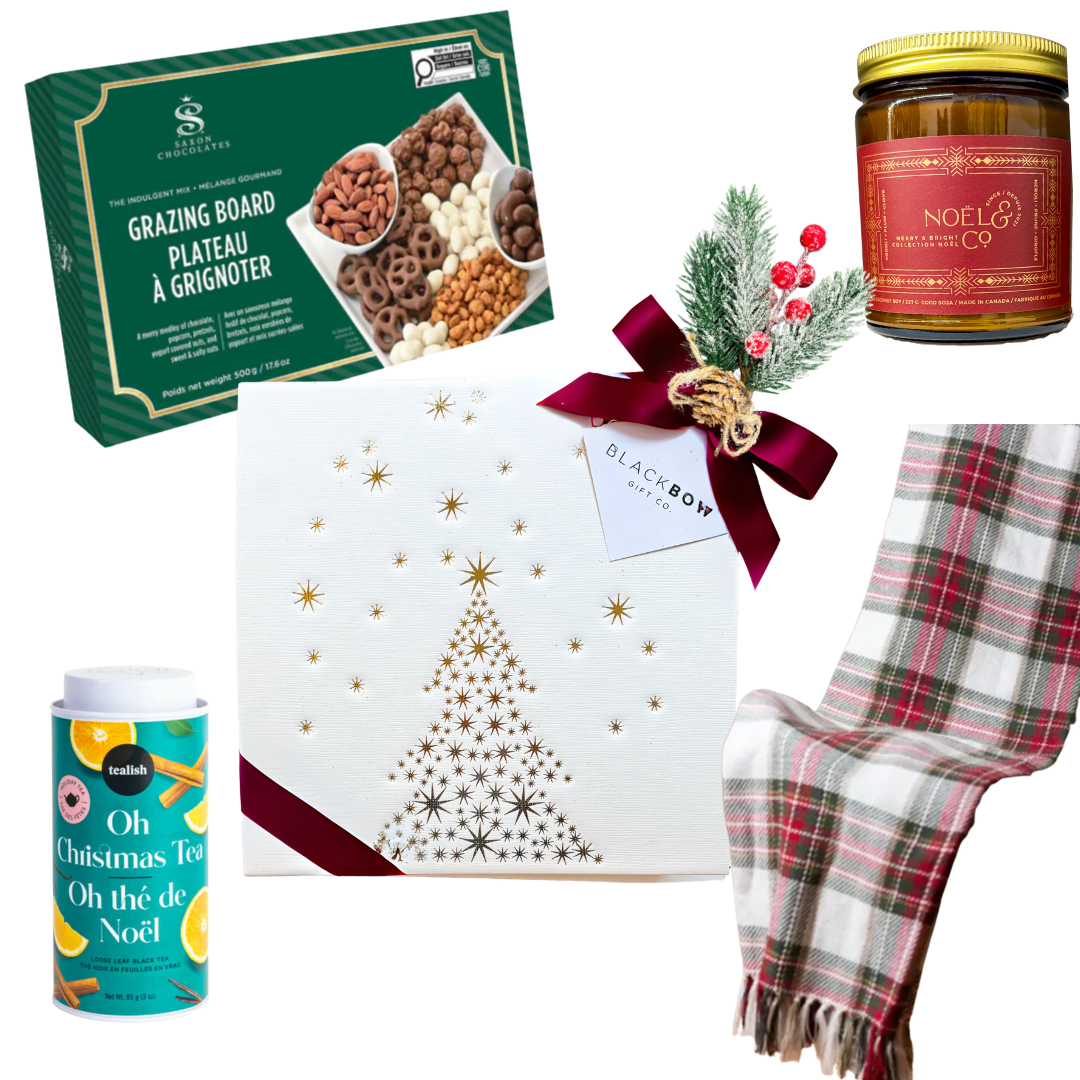 Festive Comfort holiday gift with plaid blanket, grazing treats, candle, and tea in gold-foil holiday tree box
