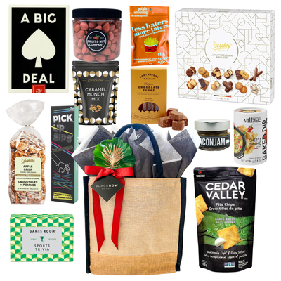 Game Night entertainment gift box featuring gourmet snacks, trivia games, popcorn seasoning, pita chips, caramel snack mix, chocolate fudge, and reusable tote curated by Black Bow Gift Co.
