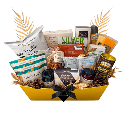 A savoury gift basket filled with premium nuts, gourmet crackers, savoury spreads, and charcuterie accompaniments, offering a mix of sweet and salty snacks for sharing among 2–8 people.