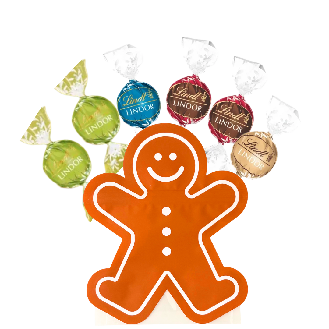 Lindt LINDOR chocolate truffles in a decorative Gingerbread Man-shaped pouch, featuring Double Chocolate, Fudge Swirl, Caramel Sea Salt, and Pistachio flavours in colourful foil wrappers, perfect for luxury gift boxes and gourmet hampers.