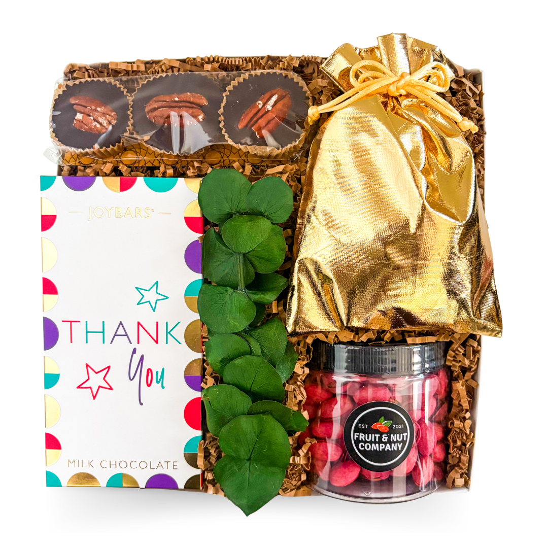 Luxury gourmet thank you gift box with Belgian milk chocolate, caramel nutty cups, chilli crisps, and red pistachios for client and corporate appreciation