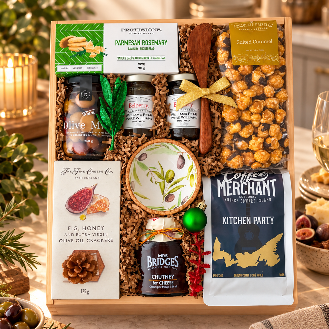 Kitchen Party gourmet gift box featuring artisan crackers, olives, preserves, chutney, PEI coffee, caramel popcorn and serving accessories in an elegant wooden tray.