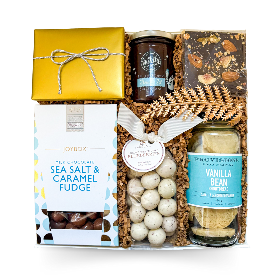Luxury gourmet indulgence gift box with sweet treats and chocolate

