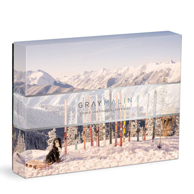 500-piece double-sided Aspen winter puzzle featuring two whimsical snowy scenes inspired by a winter wonderland.
