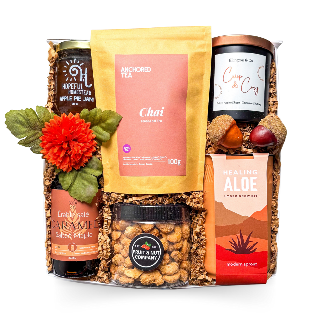 Harvest Harmony fall gift box with gourmet treats, cozy candle, and autumn wellness accents.