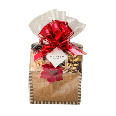 Holiday Delight Christmas chocolate gift basket with assorted chocolates and truffles in festive holiday presentation.