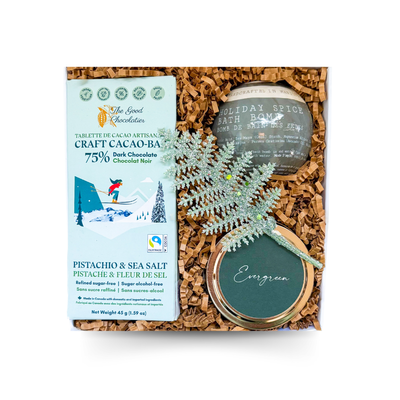 Mini luxury holiday self-care gift box with candle, bath bomb, and chocolate by Black Bow Gift Co.