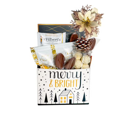 Holiday Snack Basket featuring assorted sweet and savoury treats in a festive Merry & Bright container with decorative Christmas accents.